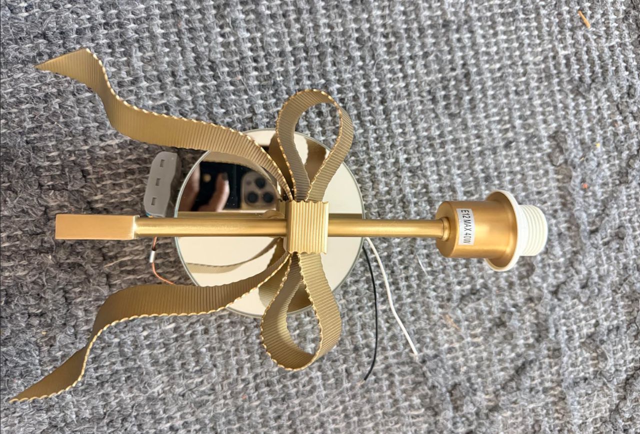Colette Mirrored Bow Wall Sconce — frameless mirror edge detail